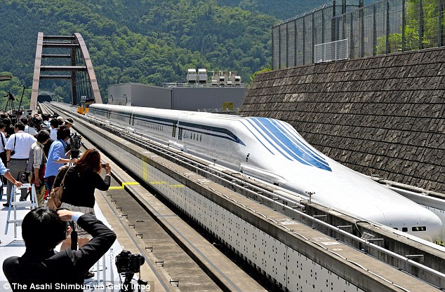 Japan's 'floating' trains of the future, designed to travel at speeds of 311mph, have undergone their first track tests. The Maglev trains use magnets to lift the train above the track, eliminating the wheels and therefore any incidence of friction, providing a faster and quieter service  Read more: http://www.dailymail.co.uk/sciencetech/article-2335785/Floating-311mph-Japanese-Maglev-bullet-train-undergoes-successful-test-run.html#ixzz2VIaIz3Pb  Follow us: @MailOnline on Twitter | DailyMail on Facebook